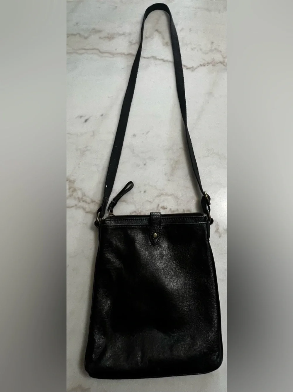 The Sak Black Leather Crossbody Bag with Gold Hardware And Colorful Lining